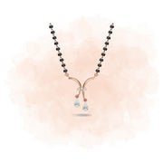 Necklace with a rose gold Y-shaped pendant on a soft pink background